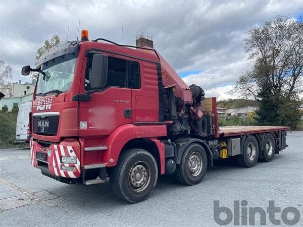 Flatbed truck with loader crane MAN TGS 35.440, 8x4/4 BL (2011)