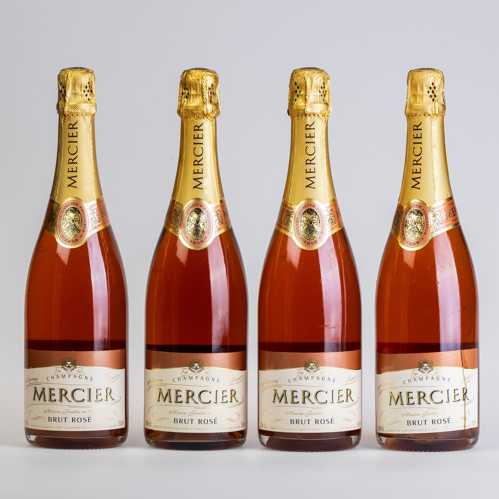 FOUR BOTTLES OF MERCIER BRUT ROSÉ.