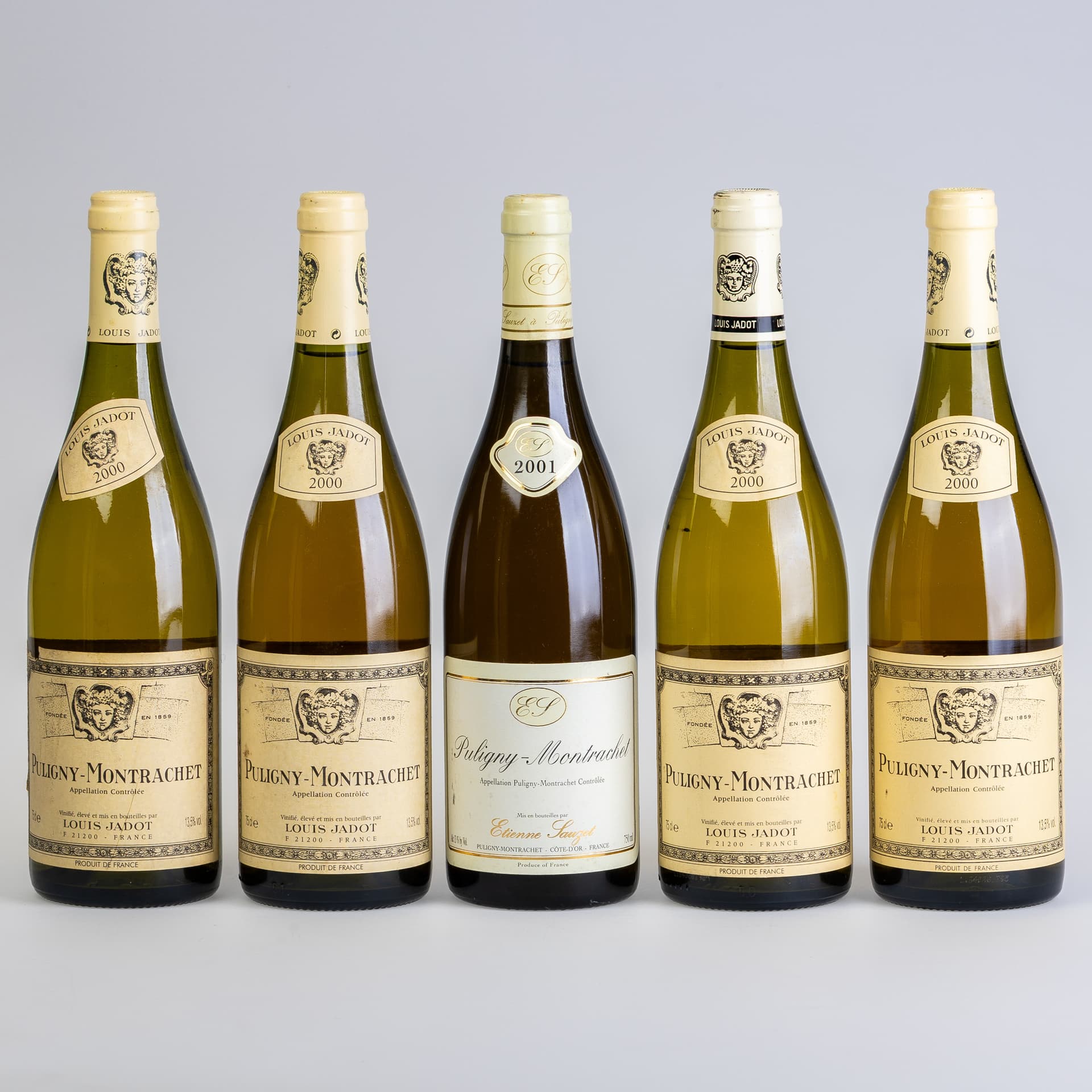 FIVE BOTTLES OF LOUIS JADOT PULIGNY-MONTRACHET WHITE BURGUNDY.