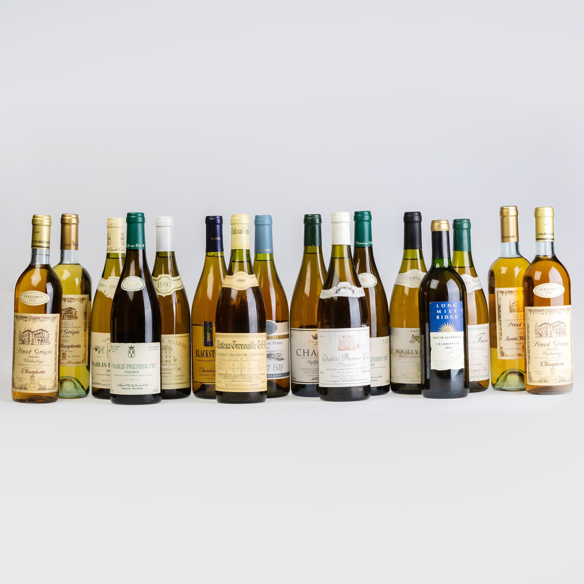 SIXTEEN BOTTLES OF VINTAGE WHITE WINE.