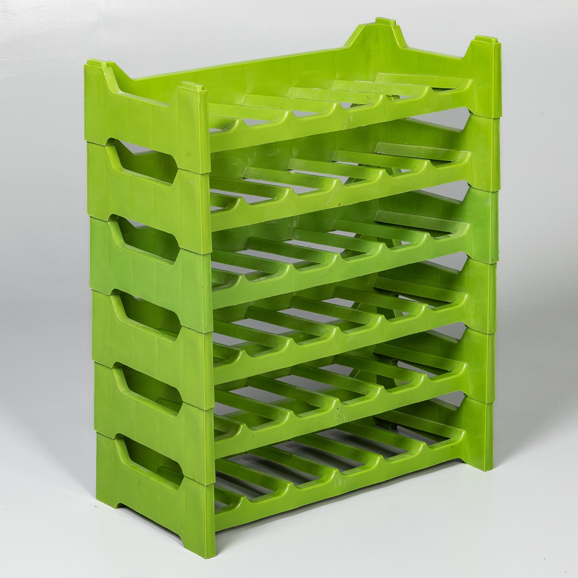 FRENCH MID-CENTURY GREEN PLASTIC MODULAR WINE RACK.