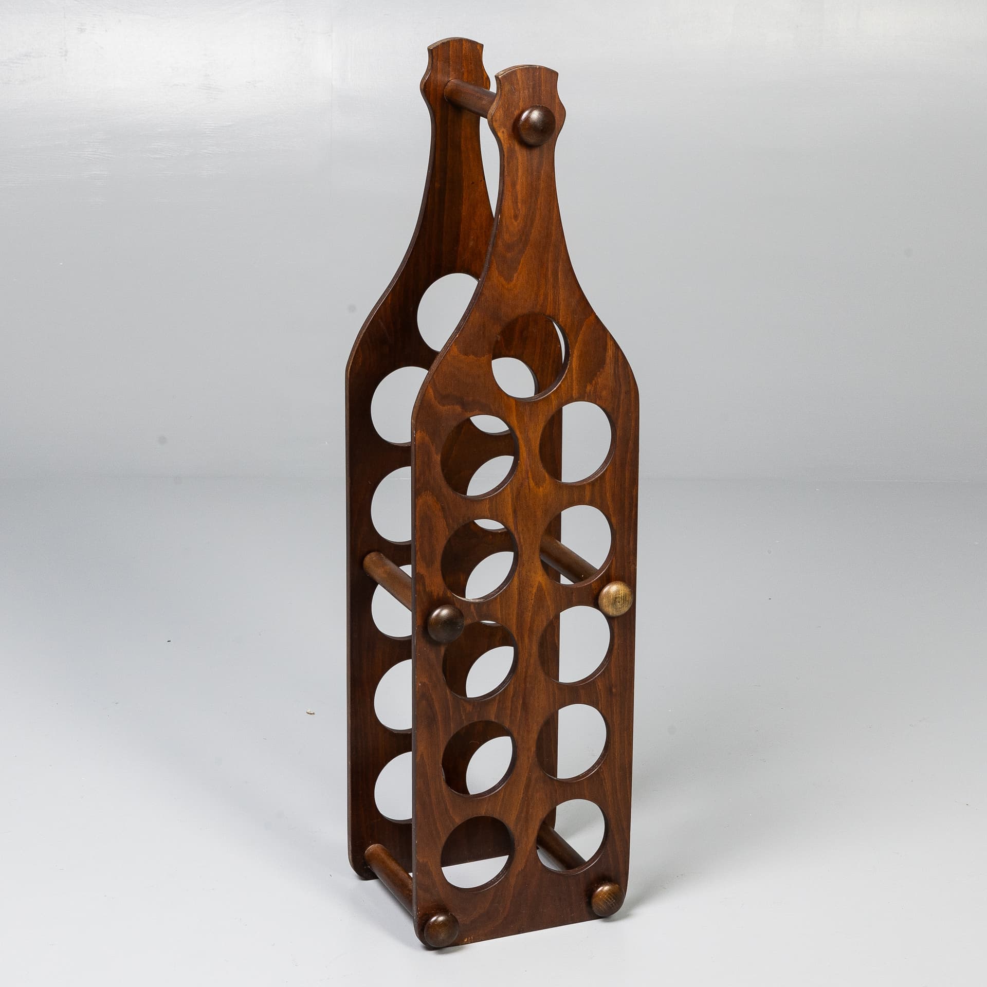 WOODEN WINE RACK IN THE SHAPE OF A WINE BOTTLE.