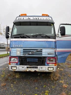 Volvo FH12-420 towing vehicle with 3 axle machine trailer. Repair object