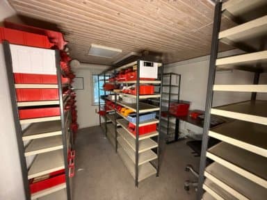 Storage room with 11 racks, desk and components