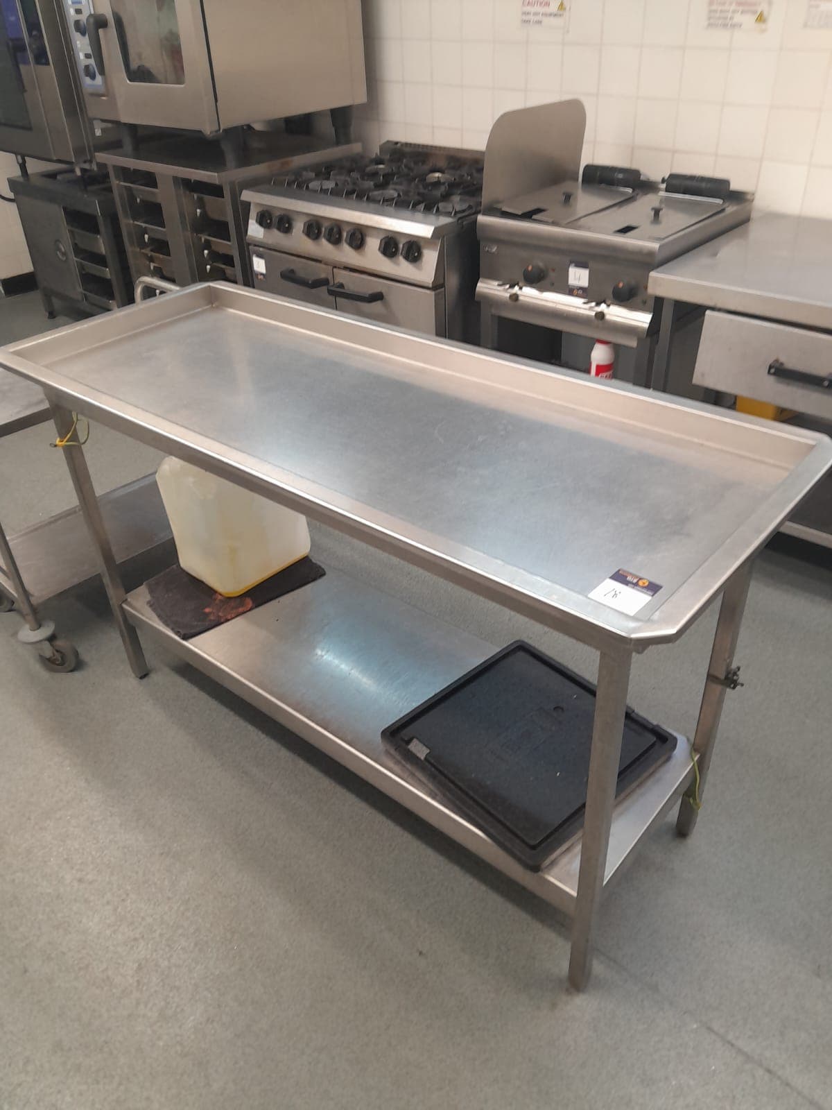 Stainless steel deep prep table 1,500 x 600mm with undershelf � Located in commercial kitchen