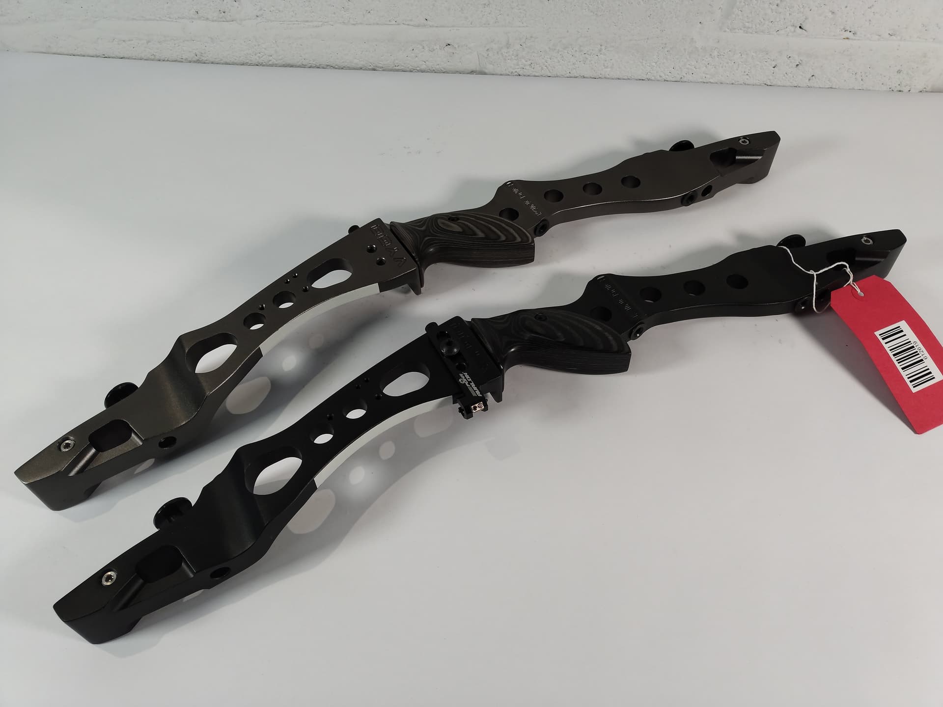 Two pre-owned Kinetic Vygo 25" recurve riser.