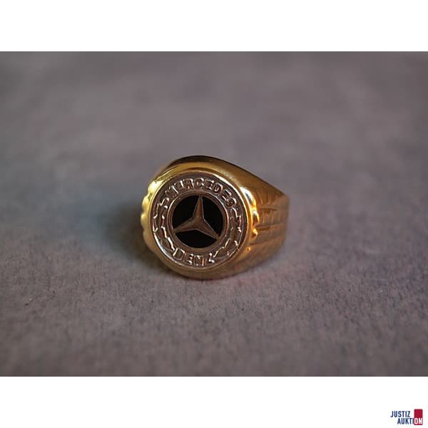 Ring with emblem