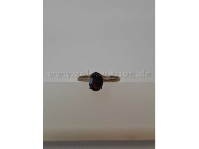 Gold ring with red pomegranate stone
