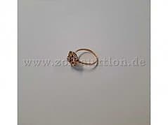 Gold ring with ornamentation and clear stone – 750 gold