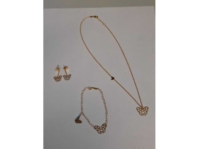 Jewelry lot including Carl Bucherer necklace, stud earrings, and bracelet